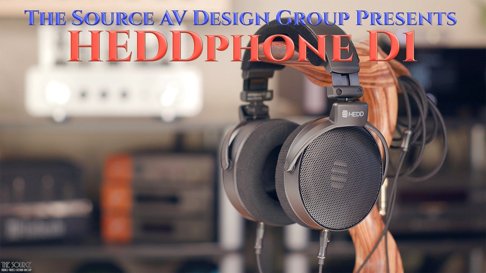 HEDDphone D1 headphones displayed on a wooden stand at The Source AV, high-end audio equipment store.