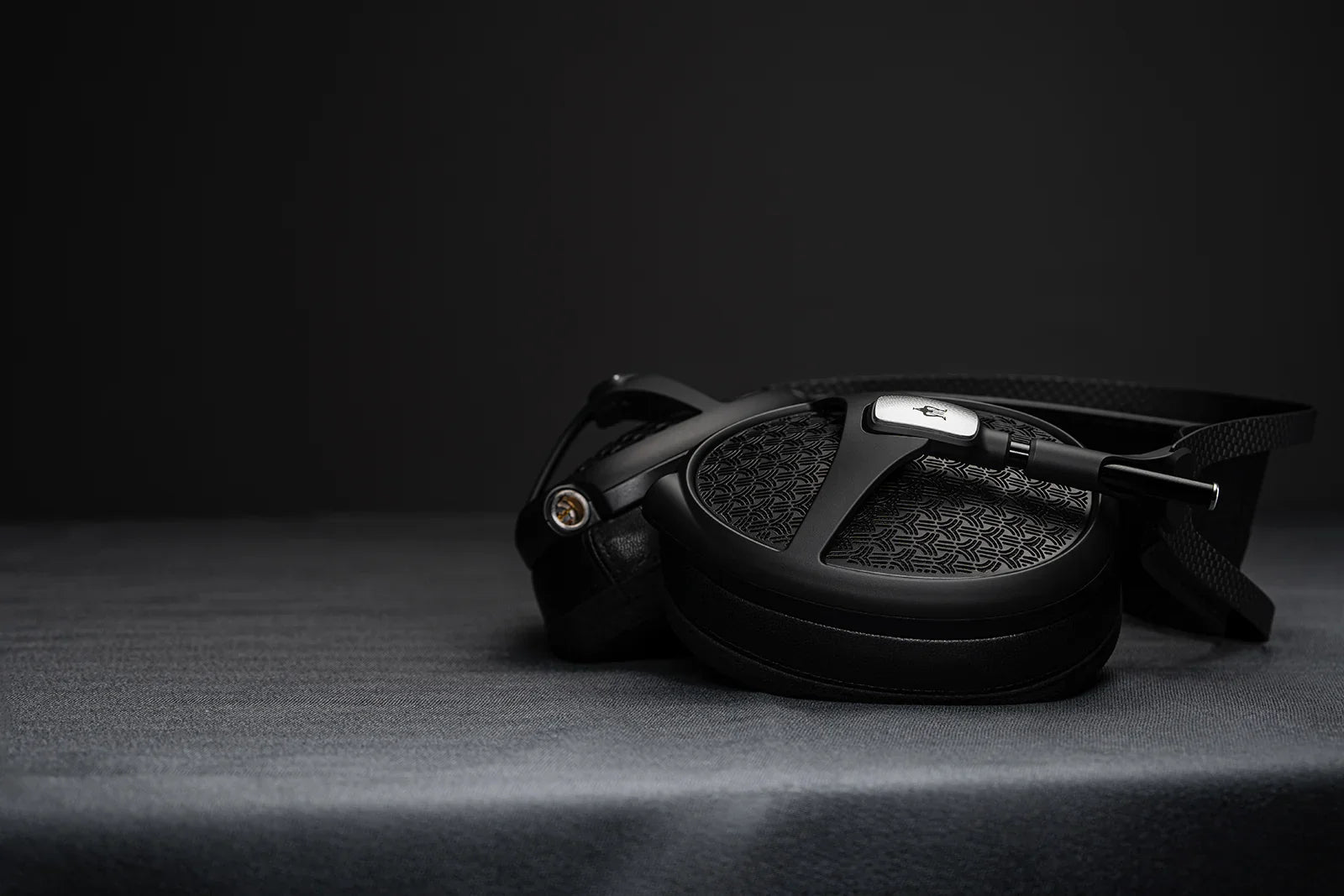 Meze Audio Empyrean II headphones with black geometric ear cup, luxury audio gear at The Source AV