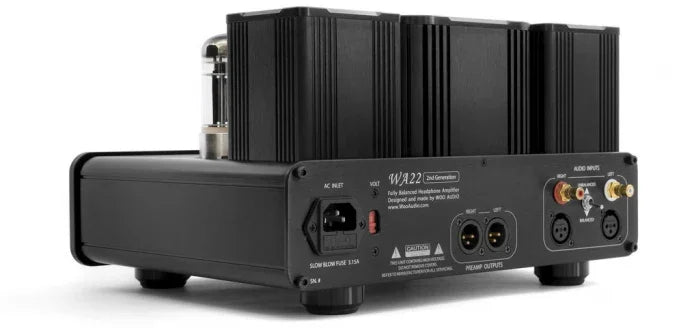 High-end tube headphone amplifier with glass vacuum tubes, front knobs, and audio connectors