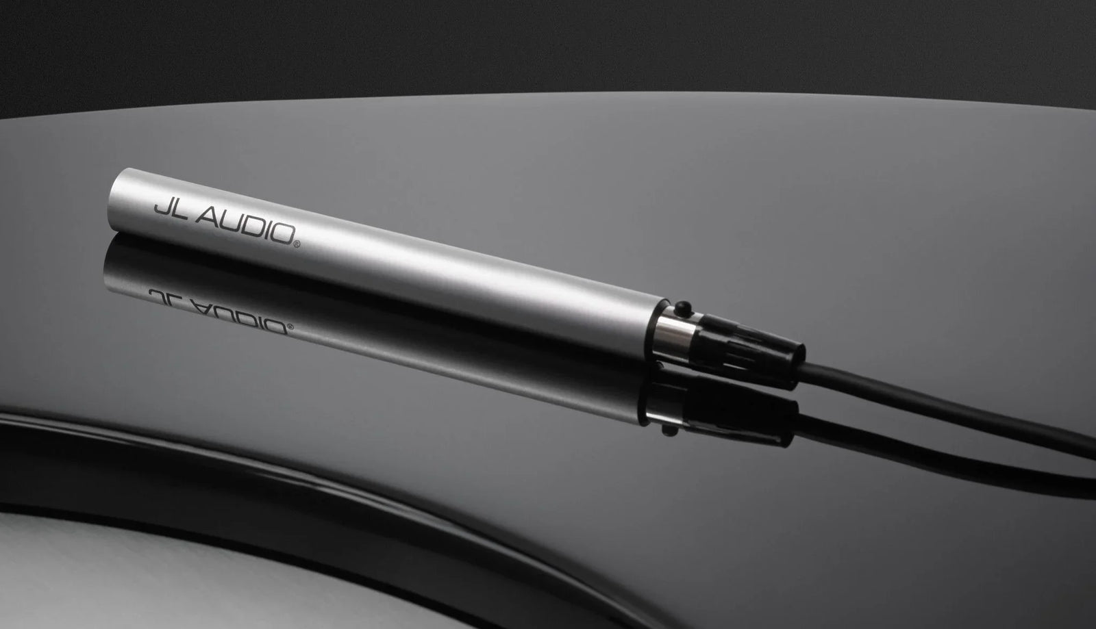 JL Audio precision calibration microphone with long black cable for audio equipment