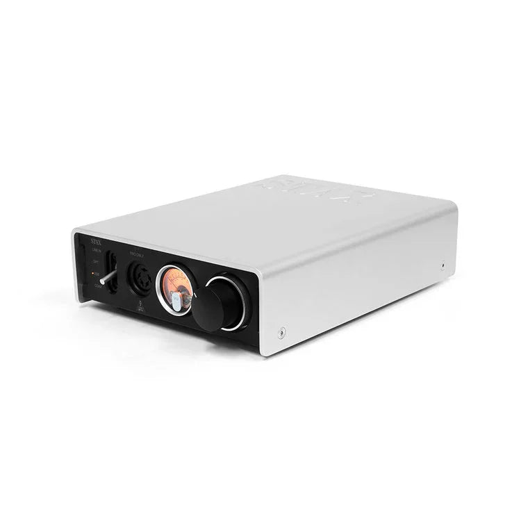 STAX headphone amplifier with VU meter, input selector, and volume knob on a white background